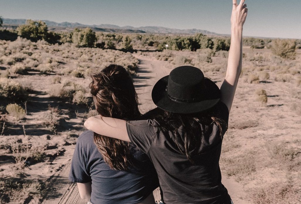Making friends when you travel: Two girls hugging.