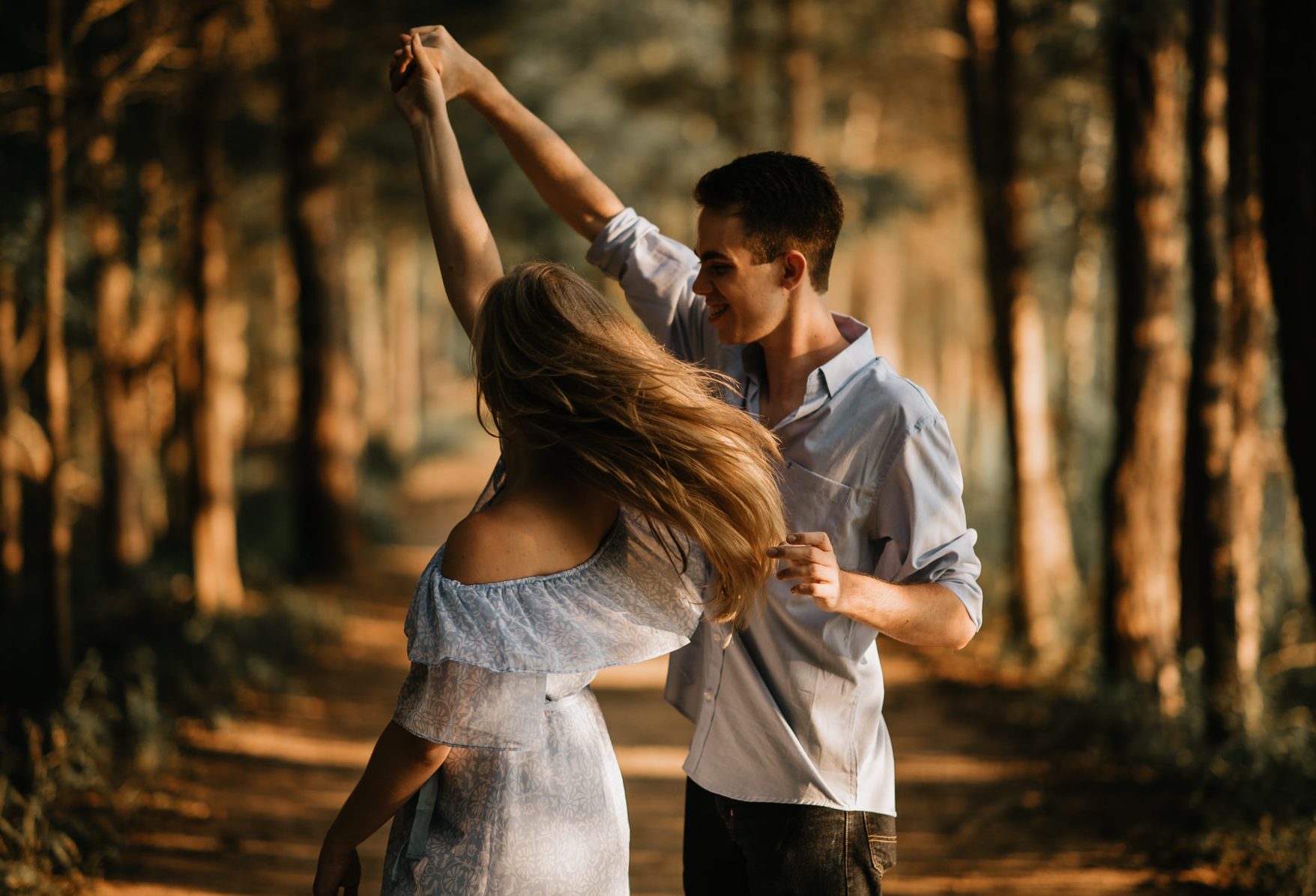 Romantic couple dancing in the forest