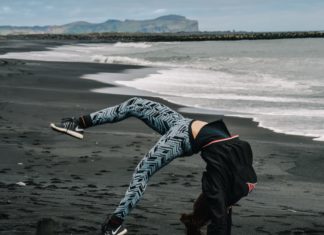 Girl doing a flip in leggings