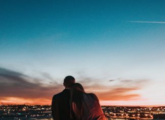 Couple sitting with candles