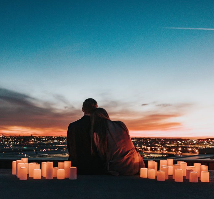 Couple sitting with candles