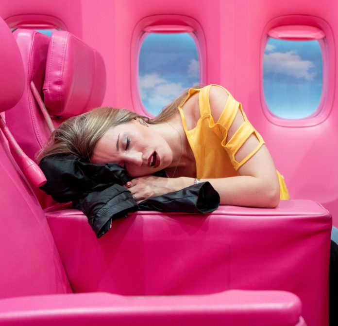Woman sleeping on plane