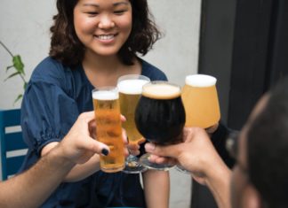 Friends cheersing with beer