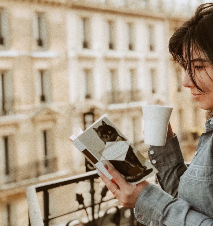 Woman reading in Paris, France