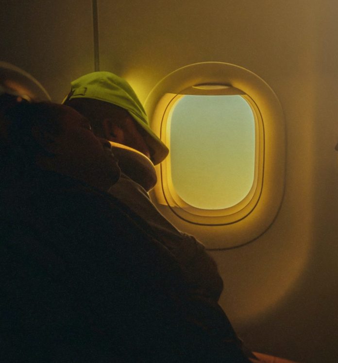 Passenger sleeping on plane