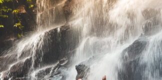 Meditating in waterfall