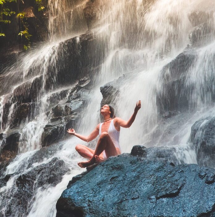 Meditating in waterfall